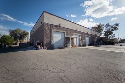 Production building and secured yard — roll-up doors and signed receiving