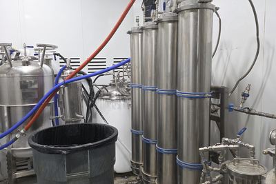 Material columns and solvent tanks within the booth